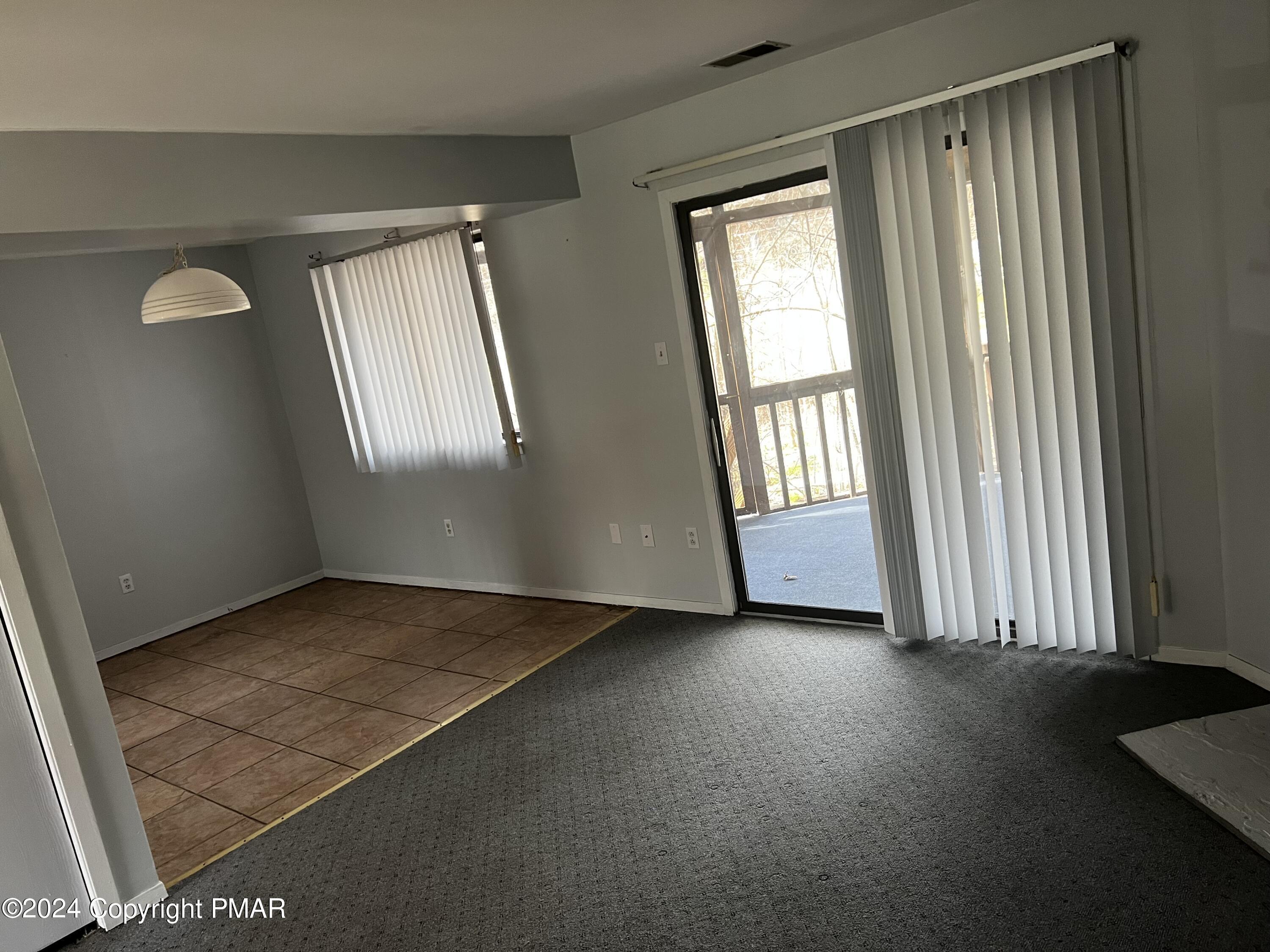 509 Wales Court Bushkill, PA 18324 - Photo 3 of 22 an empty room with windows
