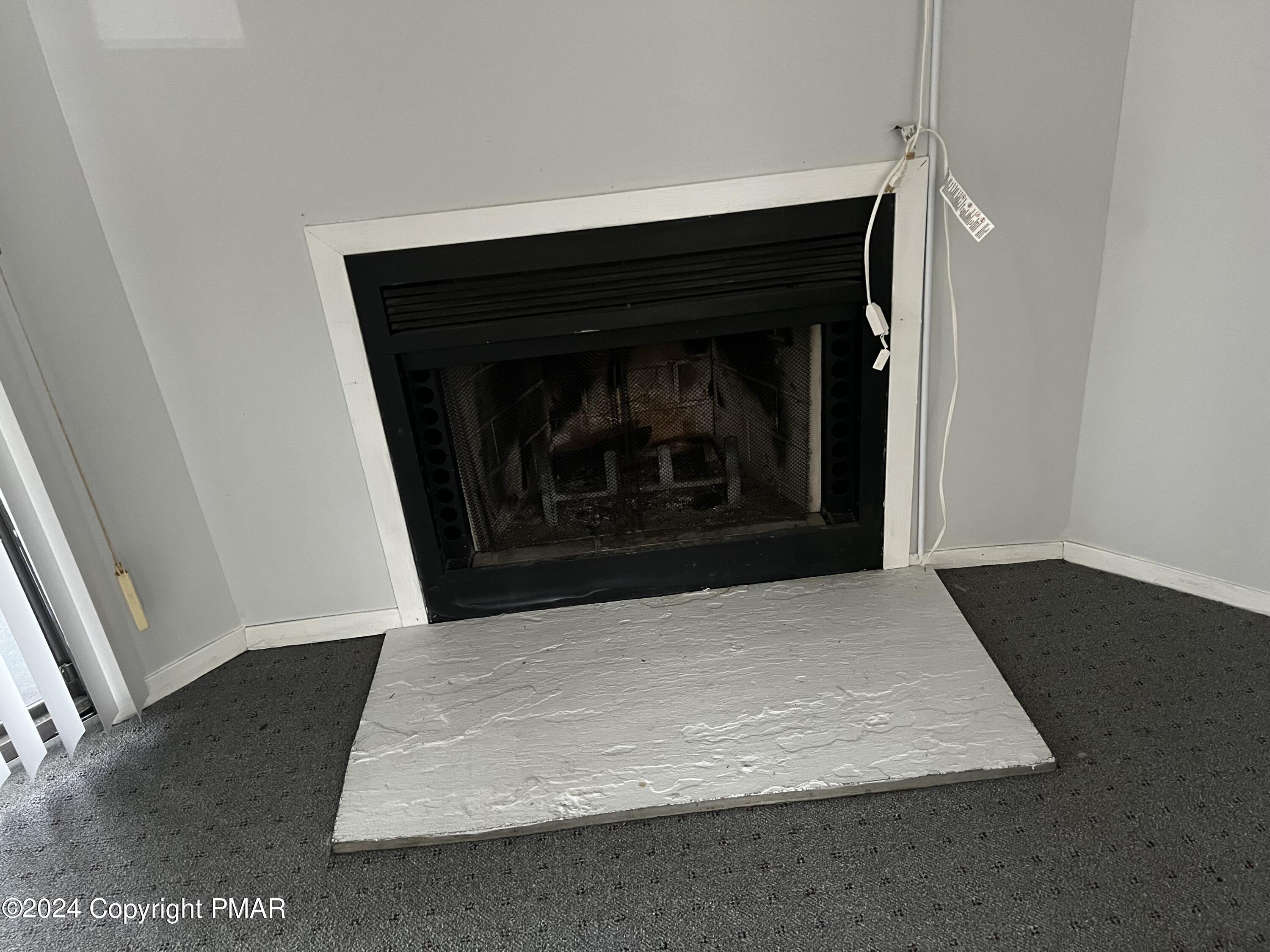 509 Wales Court Bushkill, PA 18324 - Photo 6 of 22 a living room with a fireplace