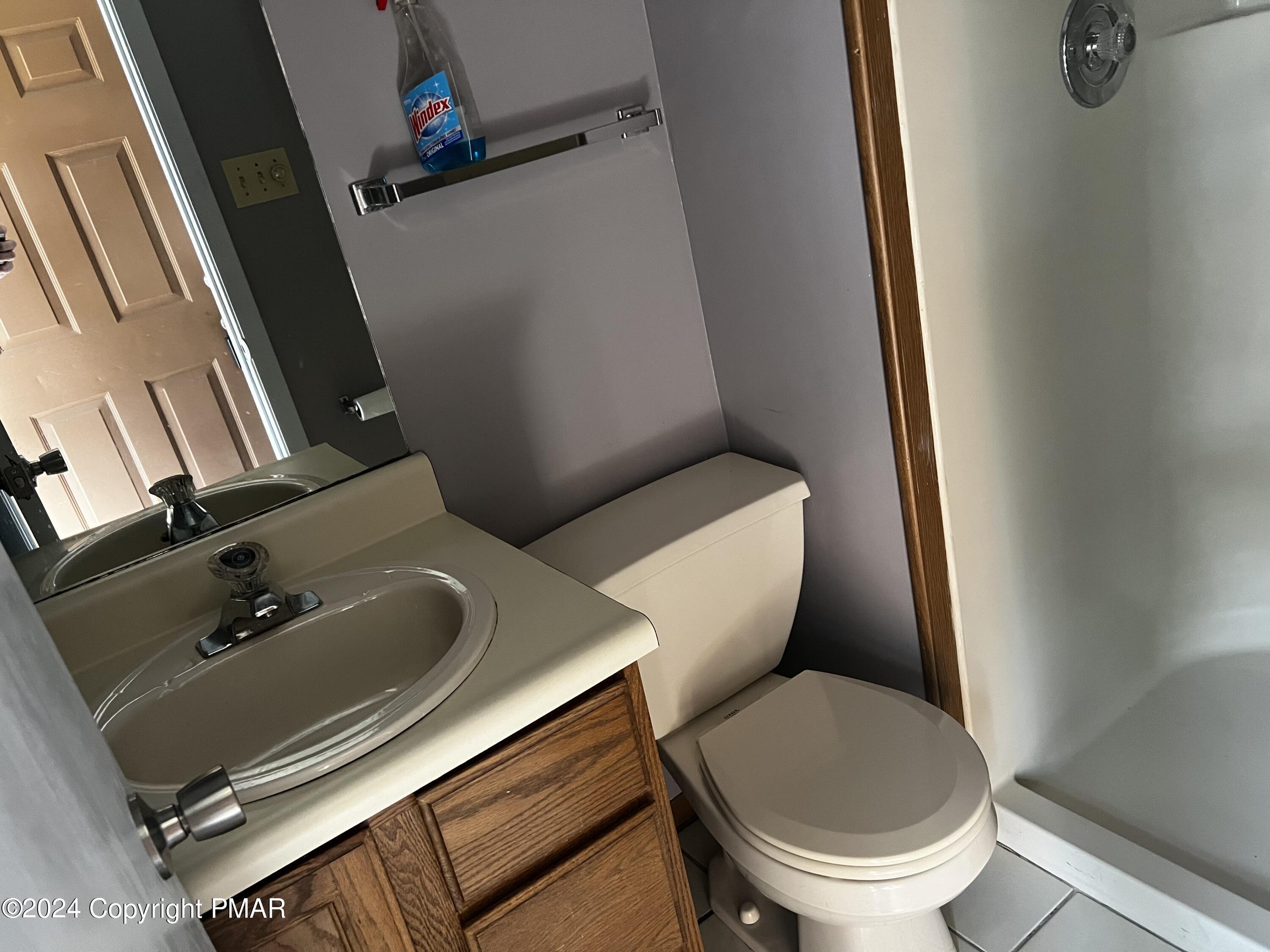 509 Wales Court Bushkill, PA 18324 - Photo 9 of 22 a bathroom with a toilet sink and mirror