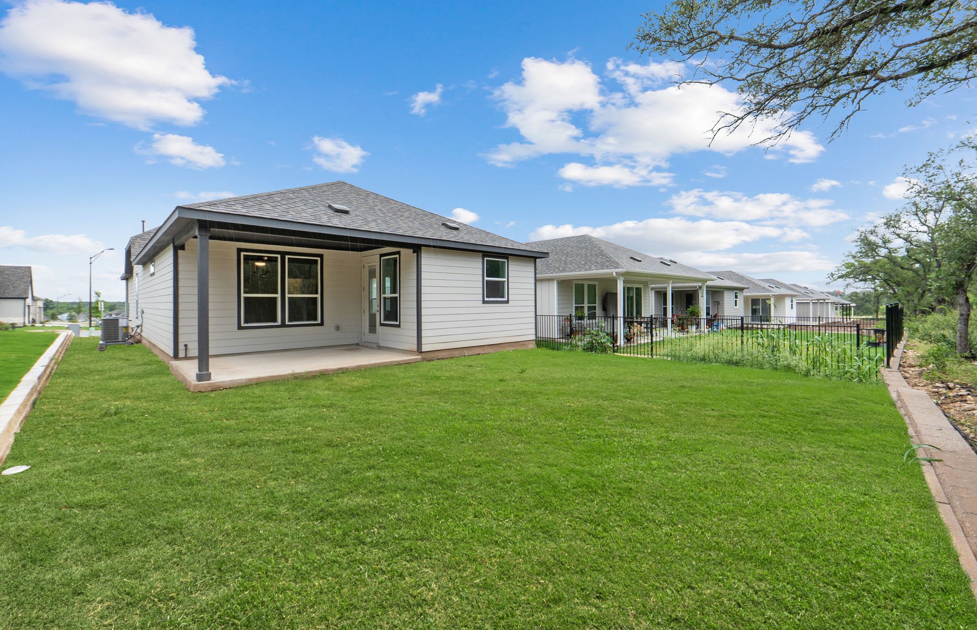 1010 Martingale Street Georgetown, TX 78633 - Photo 22 of 23 a view of a house with a backyard