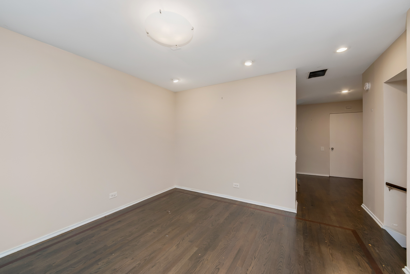 641 West Willow Street, Unit 140 Chicago, IL 60614 - Photo 13 of 22 an empty room with wooden floor and windows