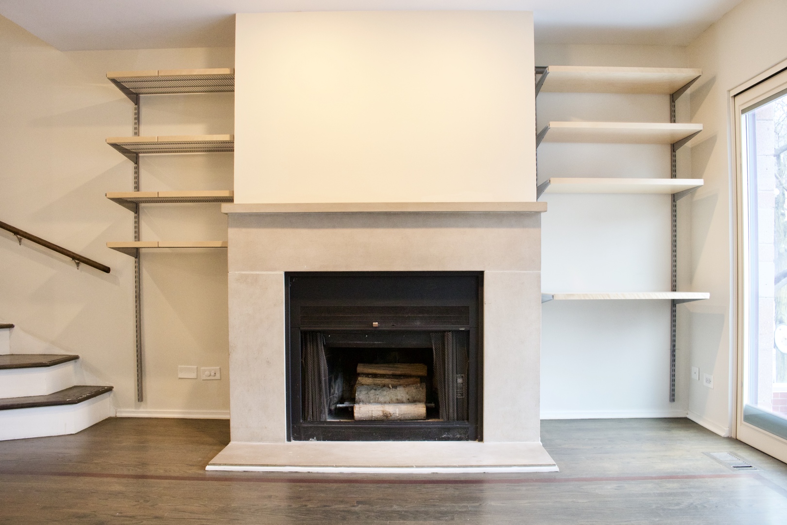 641 West Willow Street, Unit 140 Chicago, IL 60614 - Photo 9 of 22 a living room with a fireplace and a wooden floor