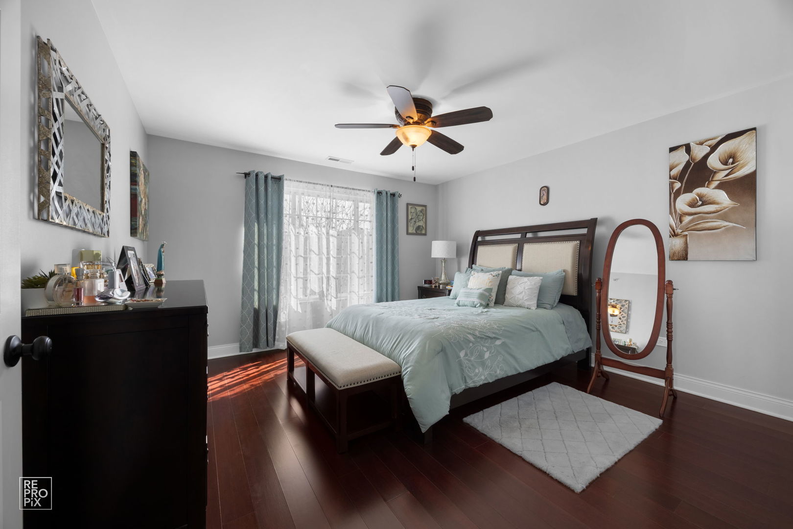 7504 Claridge Drive, Unit E Bridgeview, IL 60455 - Photo 12 of 25 a bedroom with a bed and wooden floor