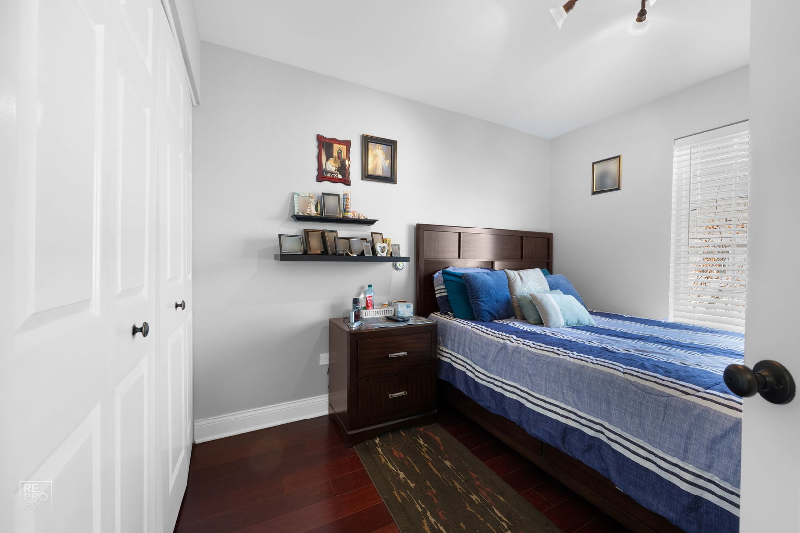 7504 Claridge Drive, Unit E Bridgeview, IL 60455 - Photo 14 of 25 a bedroom with a bed and wooden floor