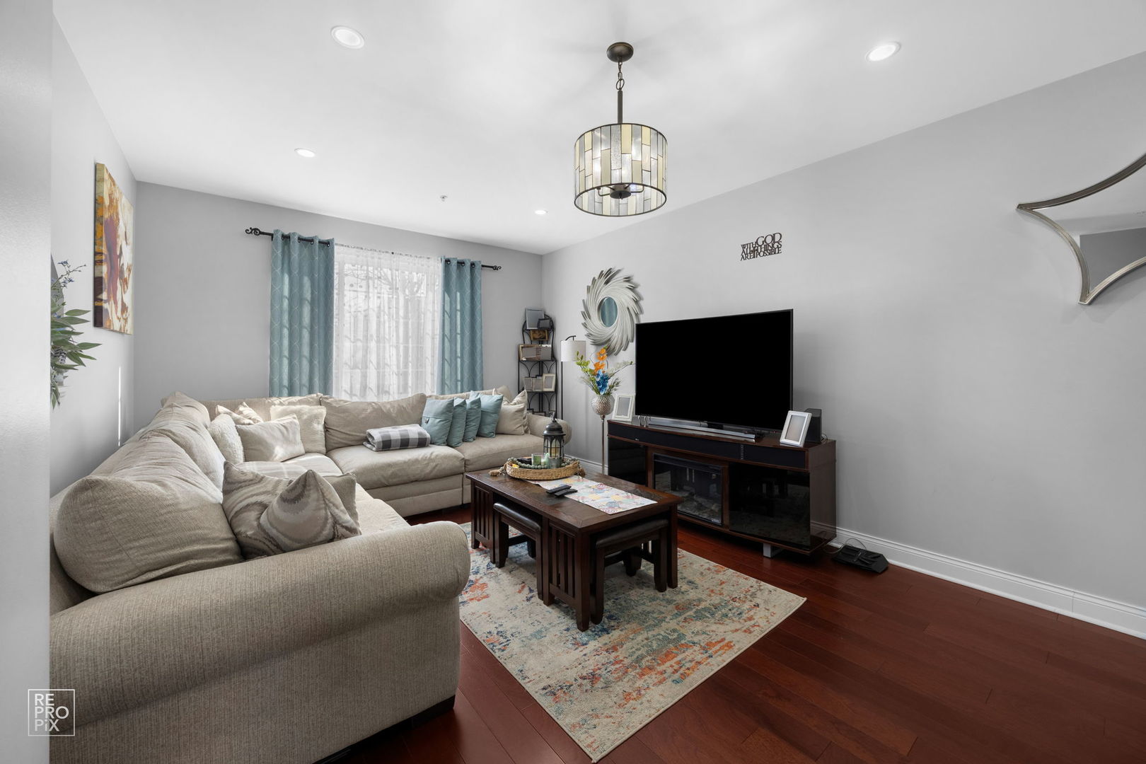 7504 Claridge Drive, Unit E Bridgeview, IL 60455 - Photo 4 of 25 a living room with furniture and a flat screen tv