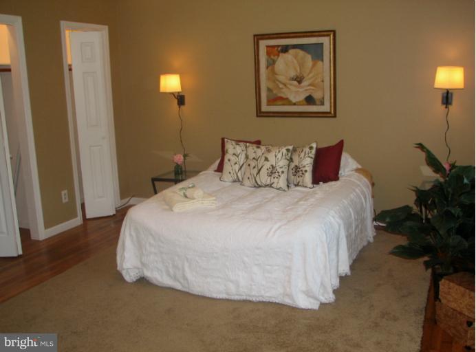 7218 Wilson Road Marshall, VA 20115 - Photo 14 of 30 a bed room with a bed and a painting