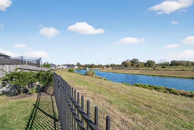 a view of an ocean and trees