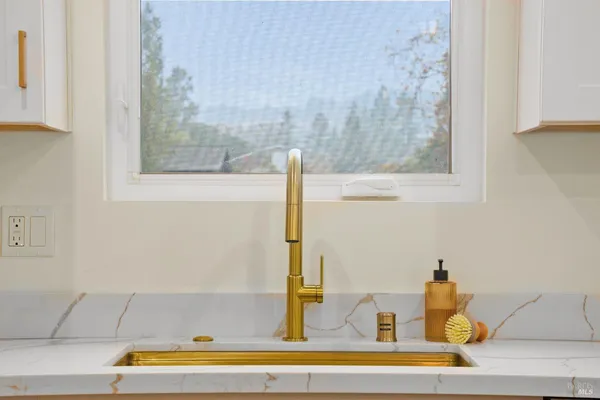 a bathroom with a bathtub and mirror