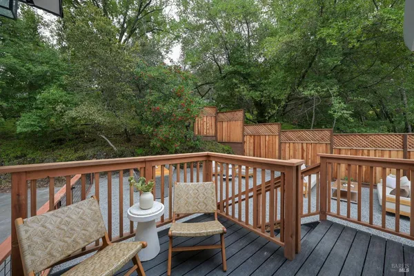 a view of a two chairs on the roof deck