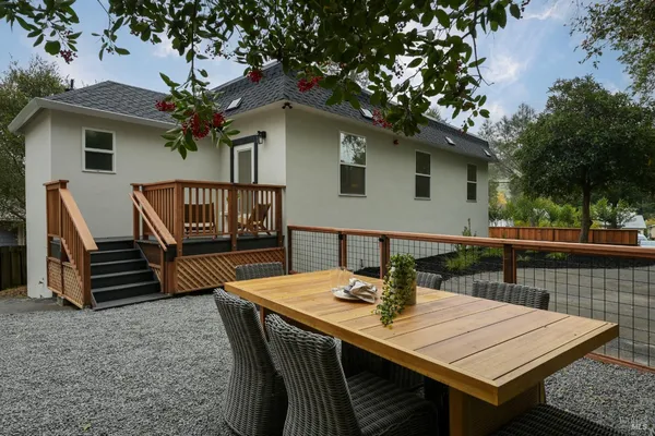 a view of a patio with a table and chairs