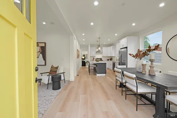 a view of a kitchen and dining room