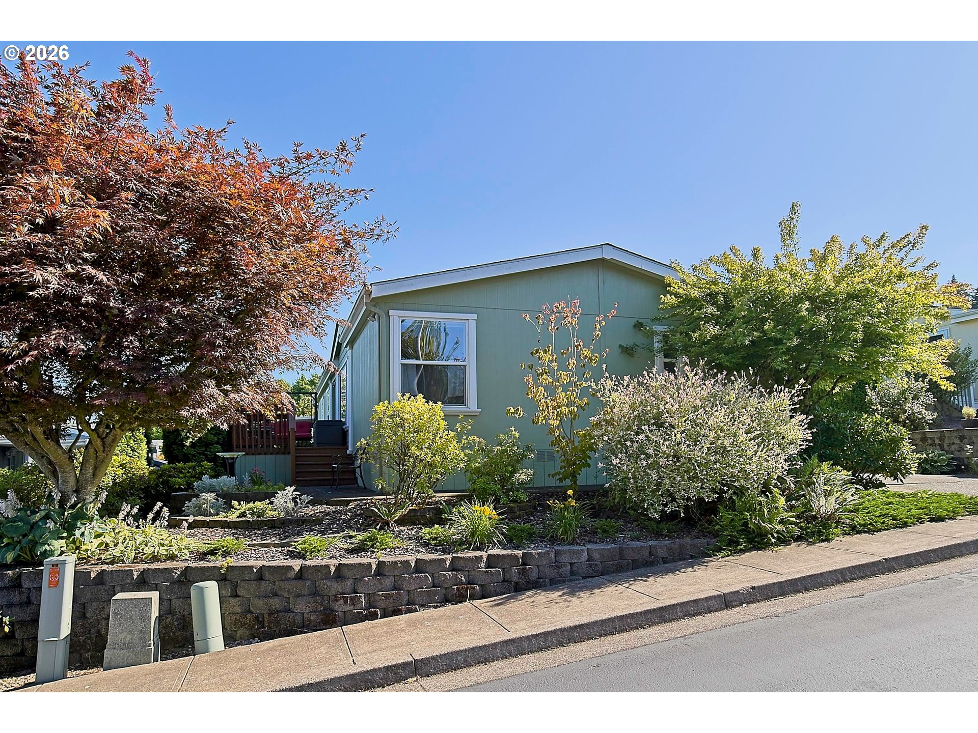 1630 Wallace Road Northwest Salem, OR 97304 - Photo 1 of 24 a front view of a house with garden