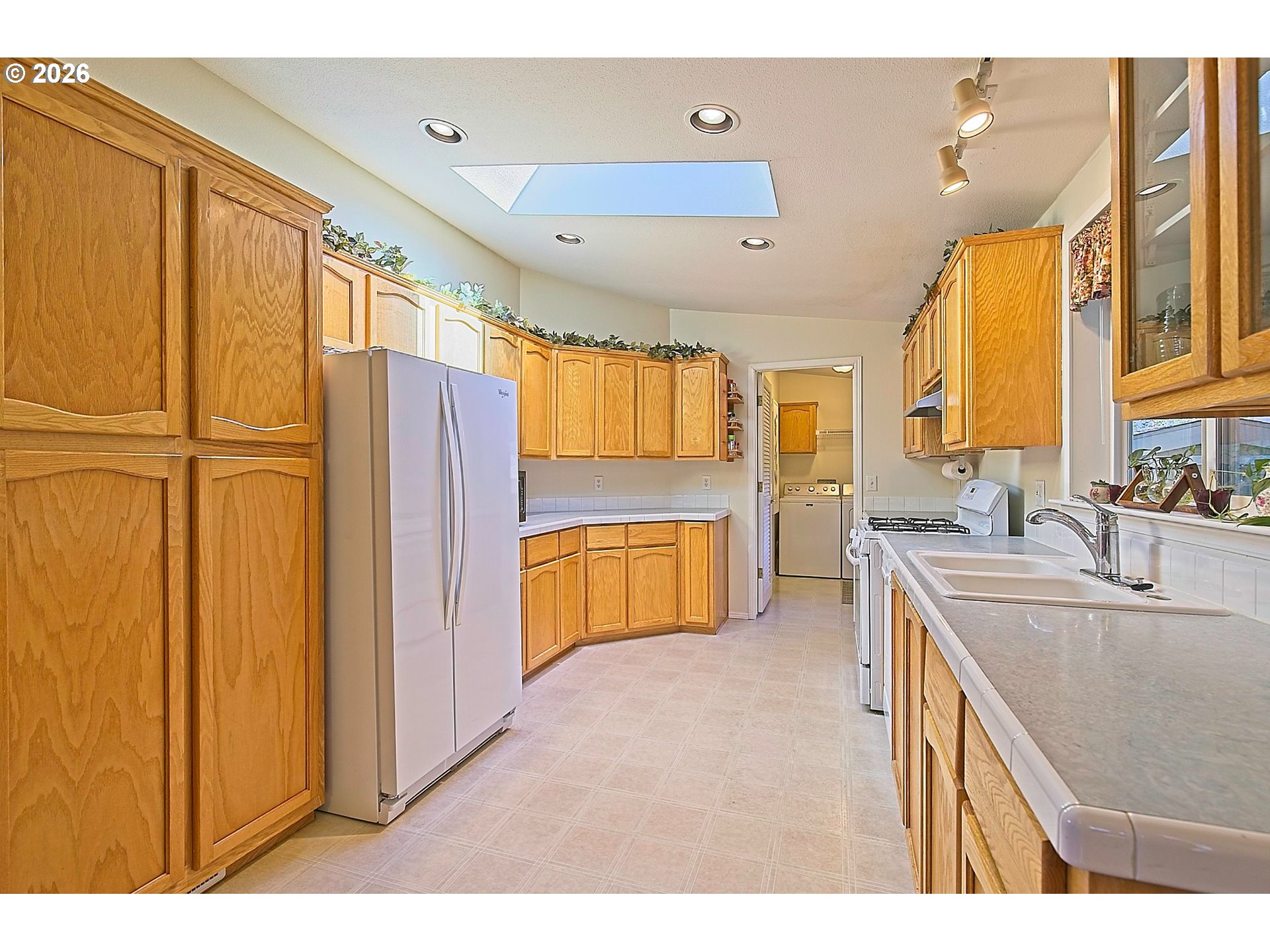 1630 Wallace Road Northwest Salem, OR 97304 - Photo 11 of 24 a kitchen with stainless steel appliances granite countertop a refrigerator a sink and a stove