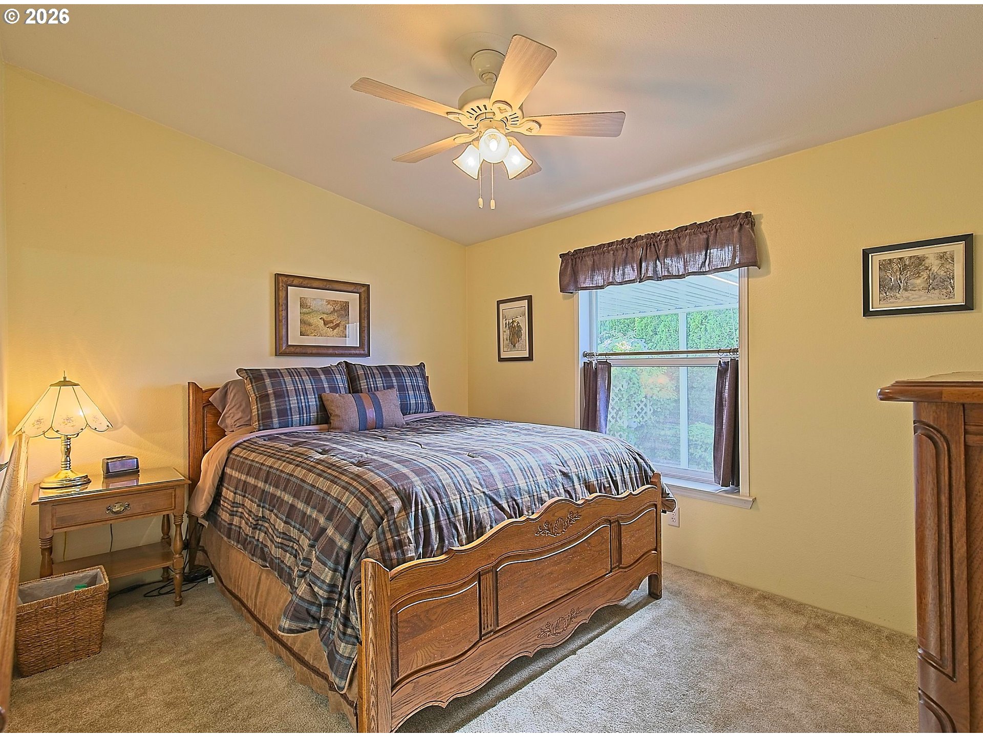 1630 Wallace Road Northwest Salem, OR 97304 - Photo 17 of 24 a bed room with a bed and a chandelier