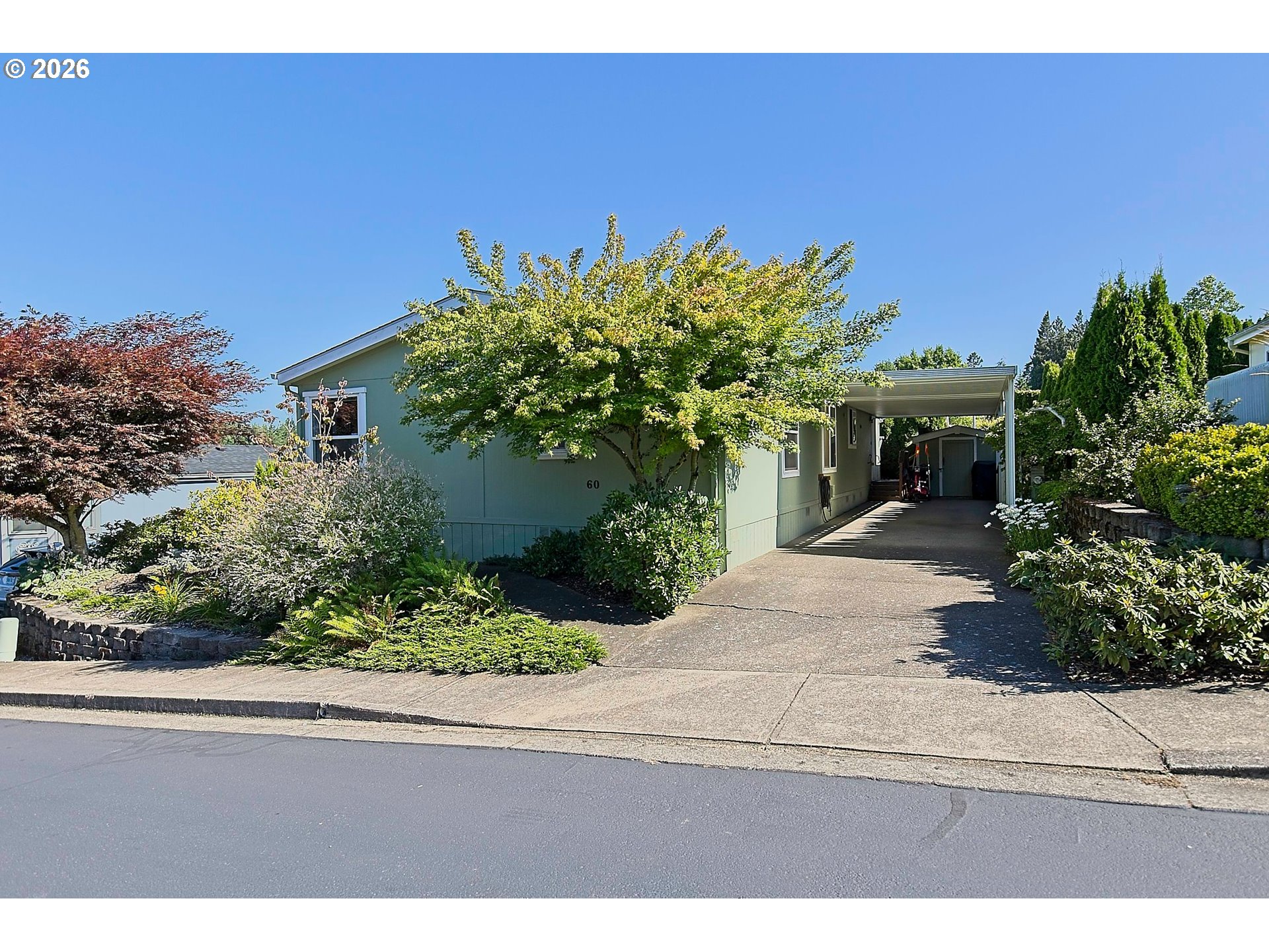 1630 Wallace Road Northwest Salem, OR 97304 - Photo 2 of 24 a front view of a house with a yard