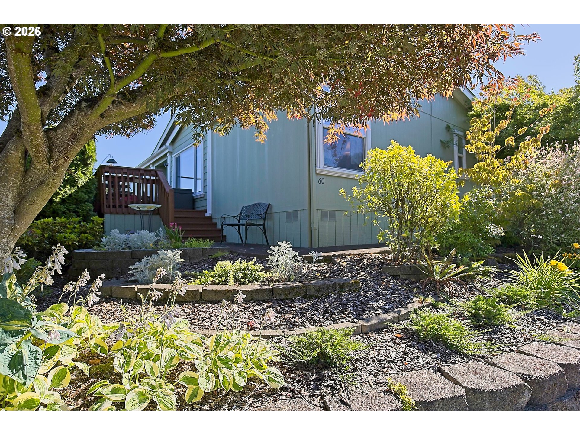 1630 Wallace Road Northwest Salem, OR 97304 - Photo 4 of 24 a front view of a house with a yard and sitting area