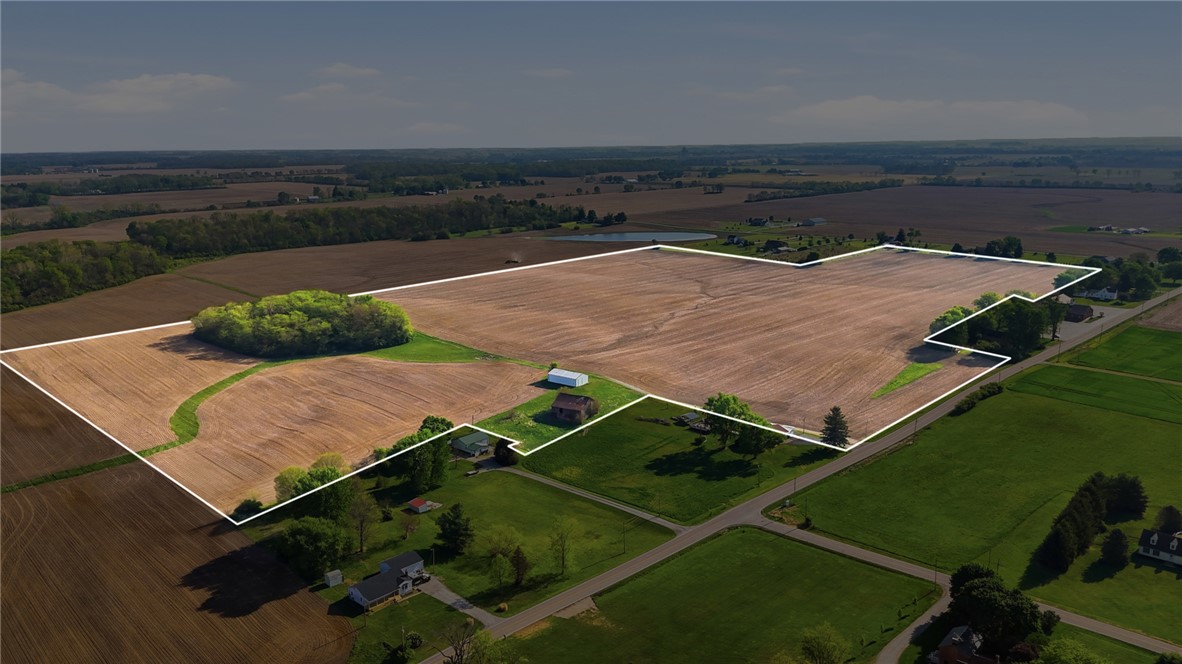 Expansive agricultural property offering fertile land and scenic rural surroundings.