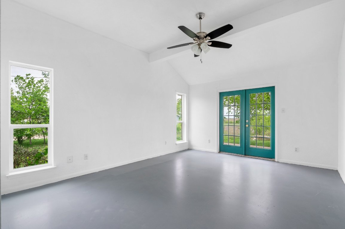 14325 South Turnersville Road Buda, TX 78610 - Photo 14 of 35 Primary bedroom has private French doors that open to the backyard