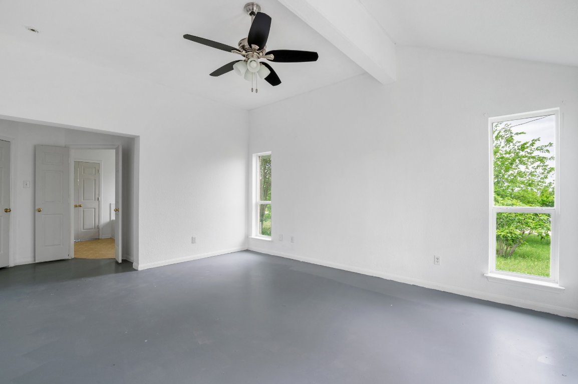 14325 South Turnersville Road Buda, TX 78610 - Photo 16 of 35 View of primary bedroom into en suite bathroom