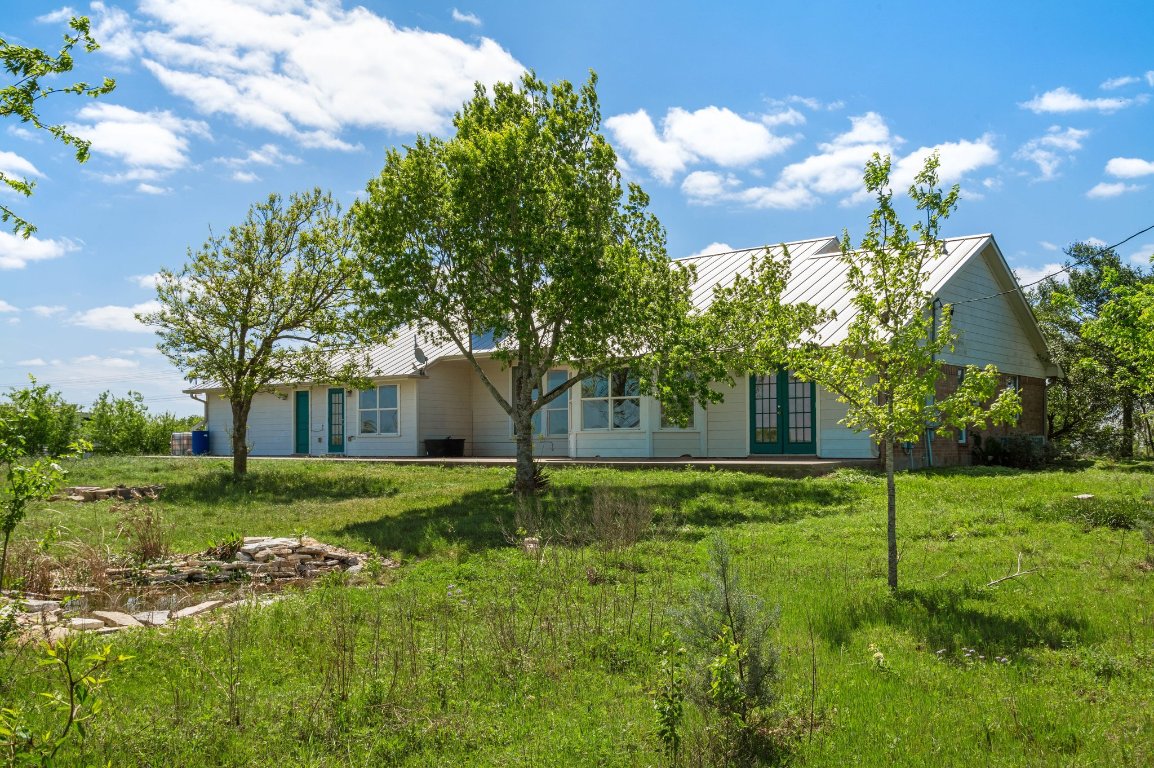 14325 South Turnersville Road Buda, TX 78610 - Photo 28 of 35 Back of house with trees
