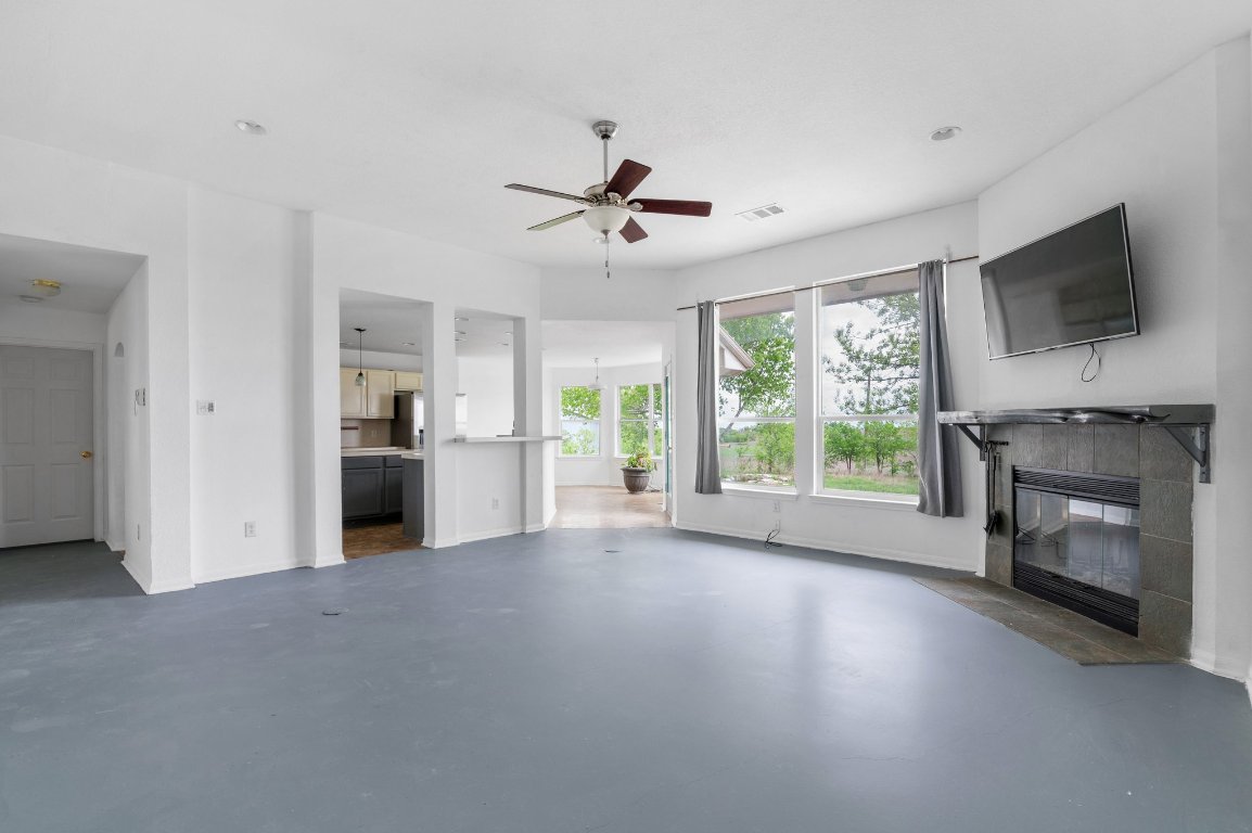 14325 South Turnersville Road Buda, TX 78610 - Photo 6 of 35 View of living room into kitchen and hallway to primary bedroom
