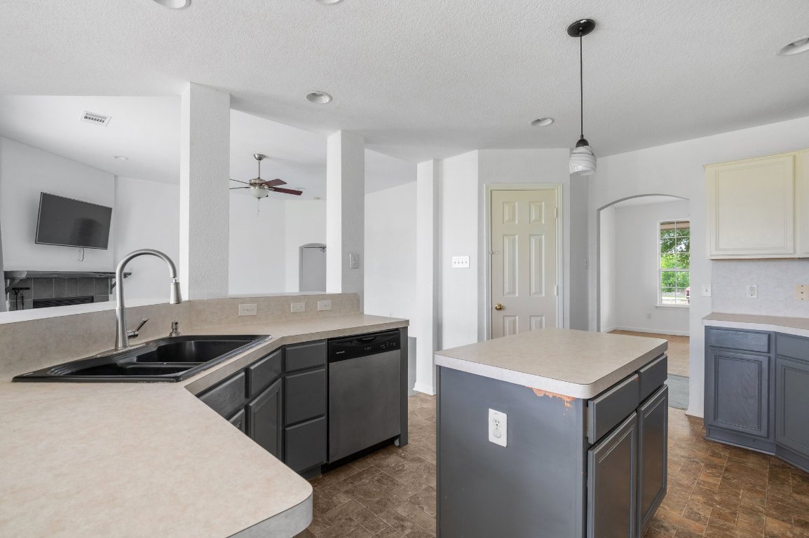 14325 South Turnersville Road Buda, TX 78610 - Photo 8 of 35 Kitchen features center island and an abundance of counter space