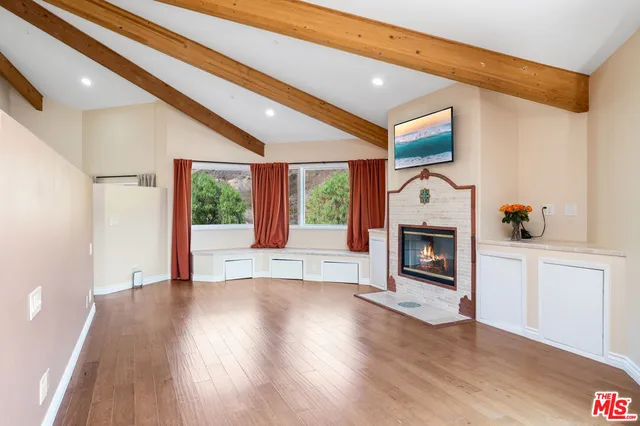 a view of city and mountain from a balcony