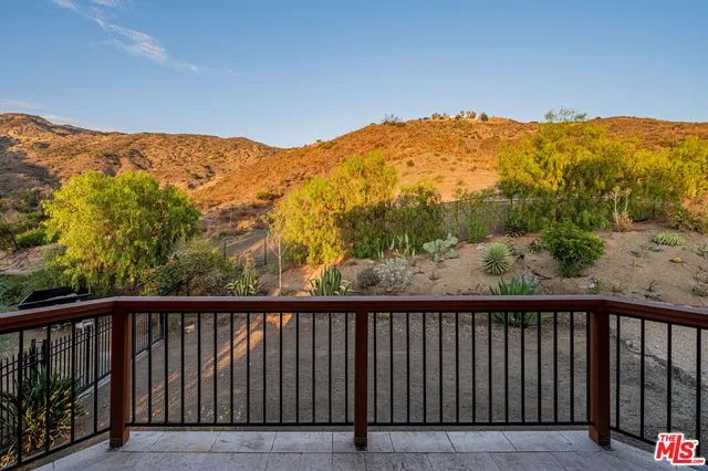 a bedroom with a bed and a walk in closet
