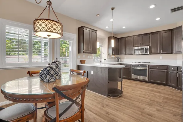 a dining room with furniture and window