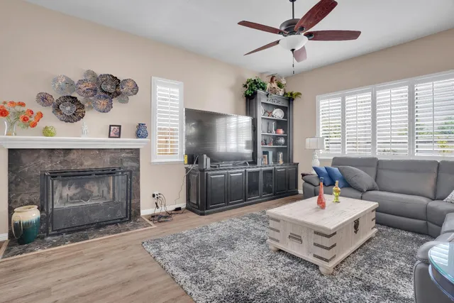a living room with furniture and a fireplace