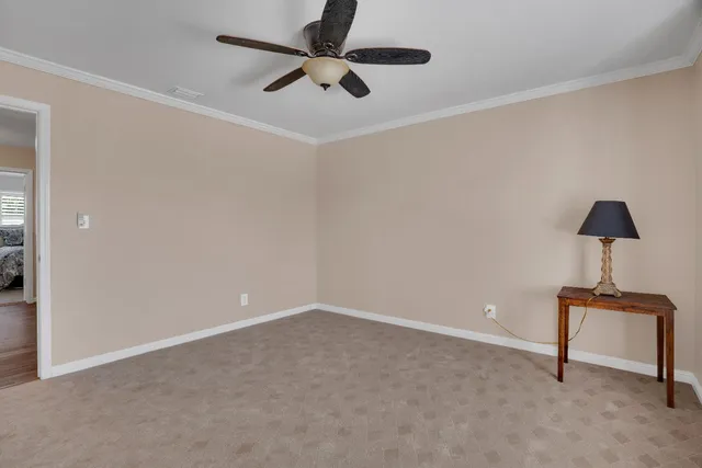 a view of room with ceiling fan and hardwood floor
