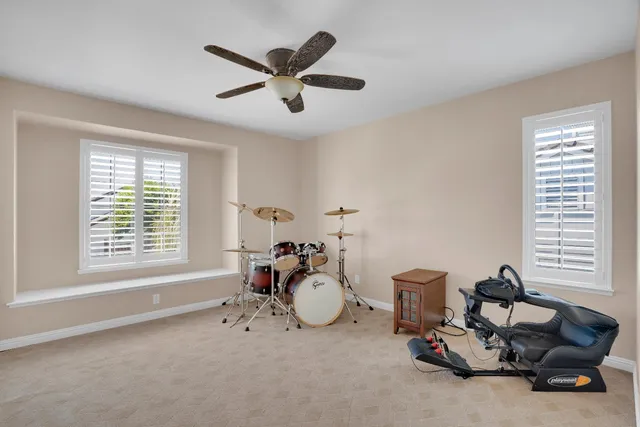 a living room with furniture and windows
