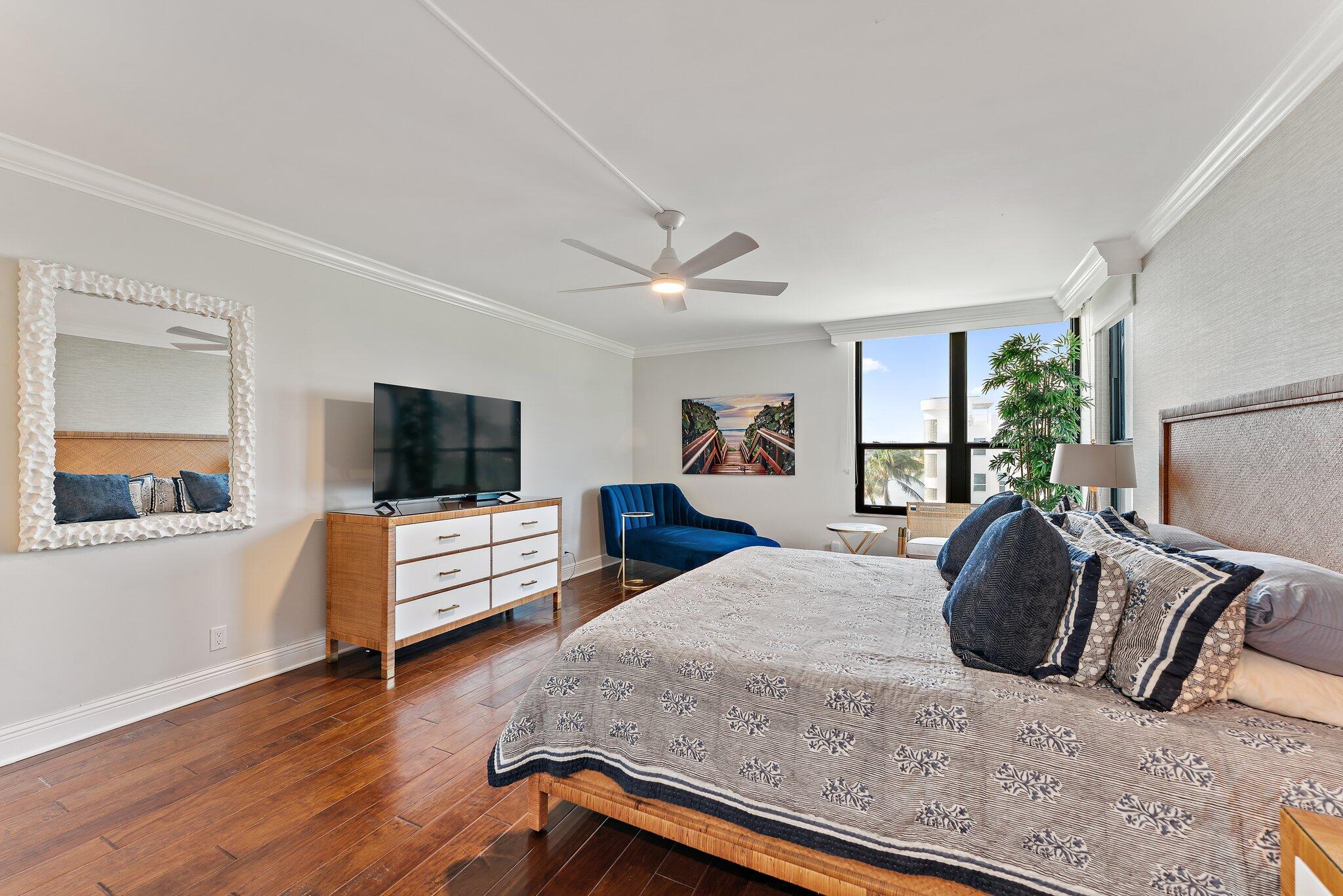 19670 South Beach Road, Unit B303 Jupiter, FL 33469 - Photo 33 of 104 a bedroom with a bed and a flat screen tv