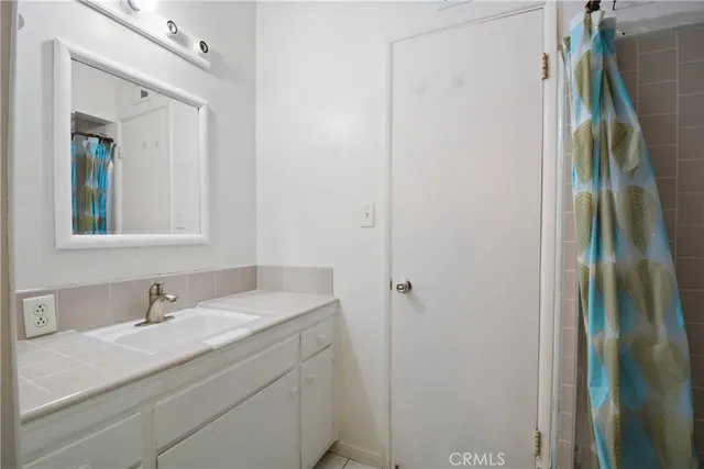 a bathroom with a sink and mirror