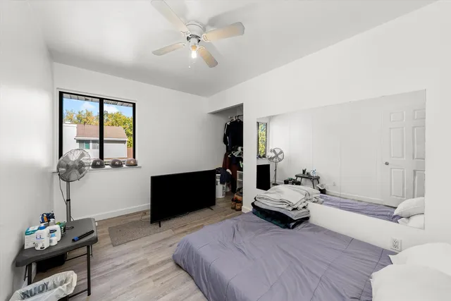 a bedroom with a bed and cabinets