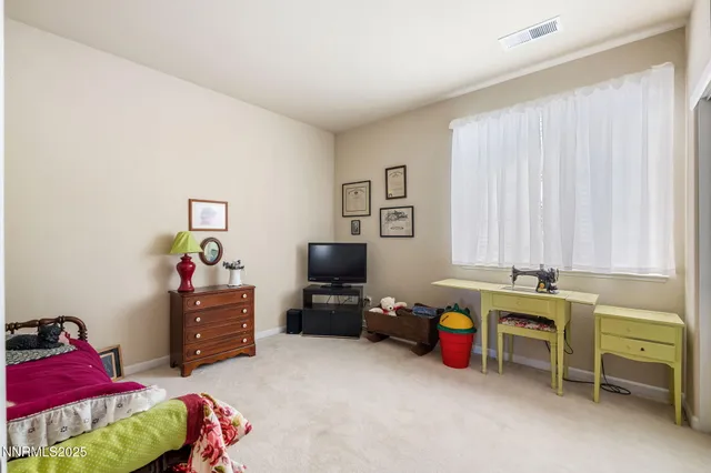 a front view of house with yard and outdoor seating