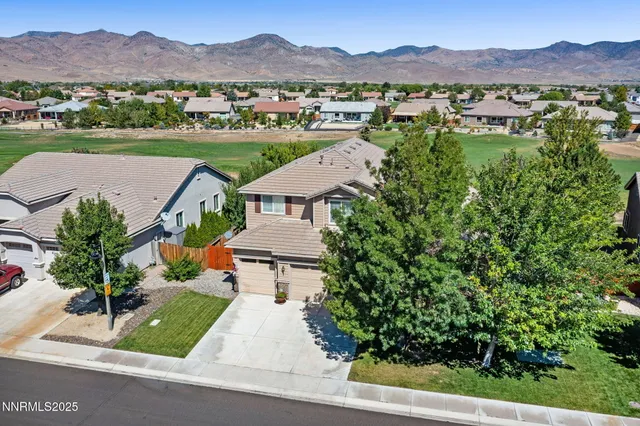 an aerial view of residential houses and outdoor space
