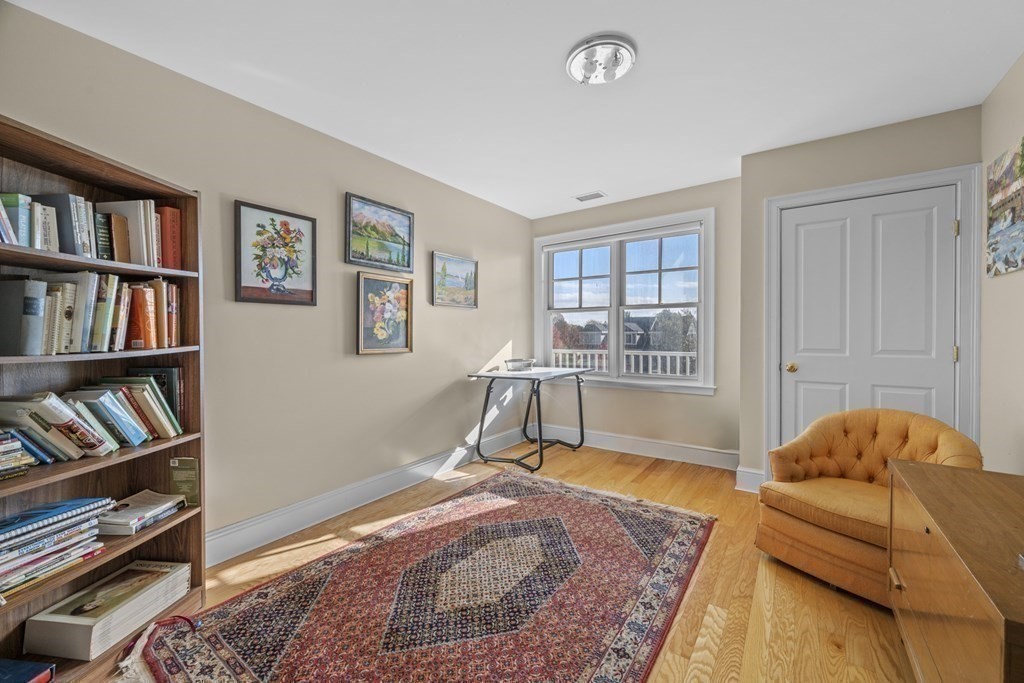 36 Intrepid Circle, Unit 303 Marblehead, MA 01945 - Photo 13 of 22 a bedroom with furniture and a book shelf