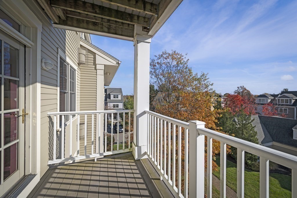 36 Intrepid Circle, Unit 303 Marblehead, MA 01945 - Photo 19 of 22 a view of a balcony with wooden floor and fence