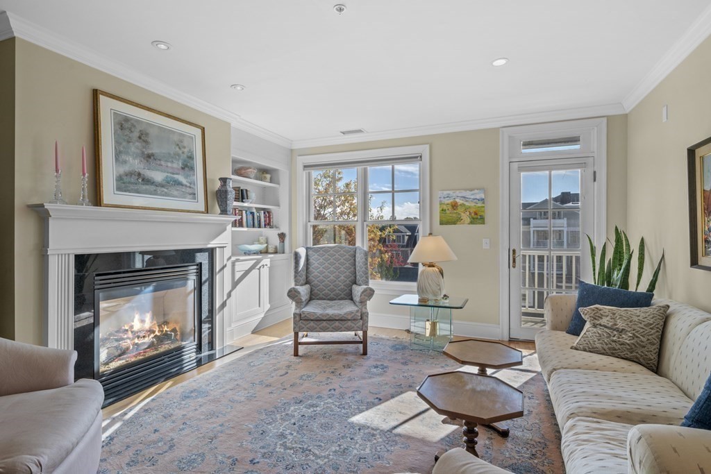36 Intrepid Circle, Unit 303 Marblehead, MA 01945 - Photo 6 of 22 a living room with furniture and a fireplace