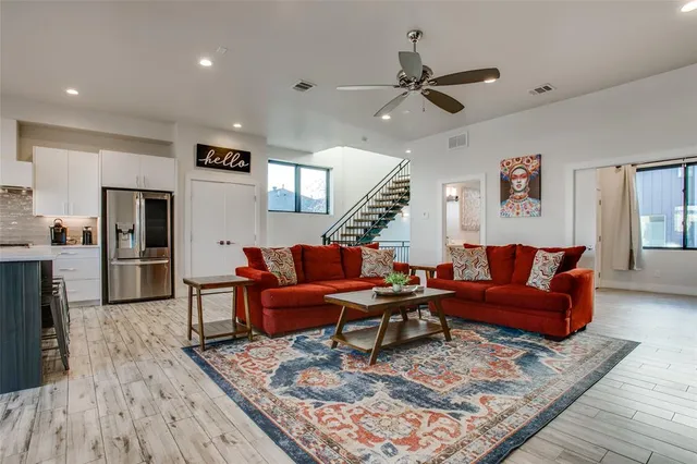 a living room with furniture and a rug