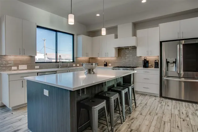 a kitchen with counter top space sink and a stove