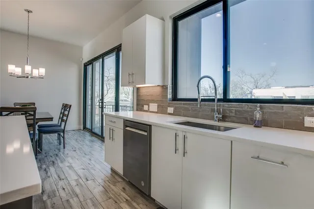 a kitchen with granite countertop a stove and a refrigerator