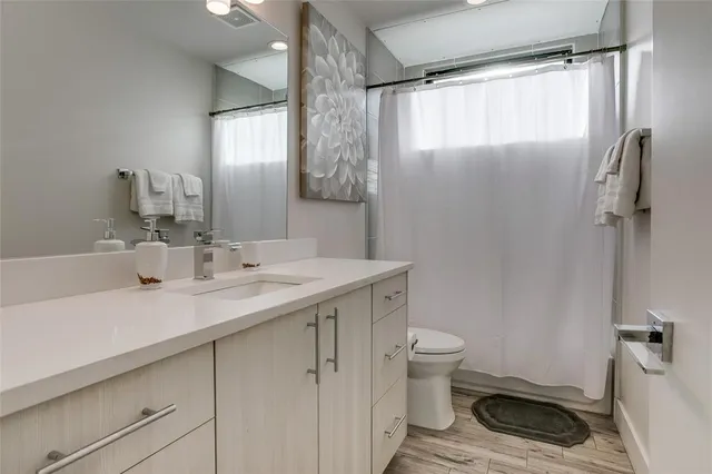 a kitchen with a table chairs stove top oven and sink