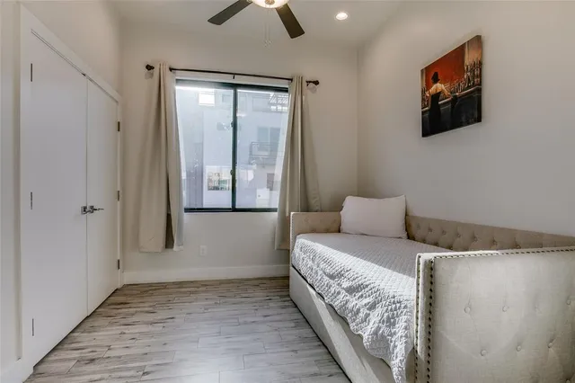a kitchen with a sink a refrigerator and chairs