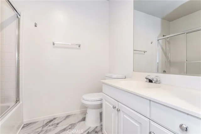 a bathroom with a sink toilet and vanity
