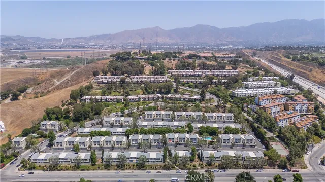 an aerial view of residential houses and street
