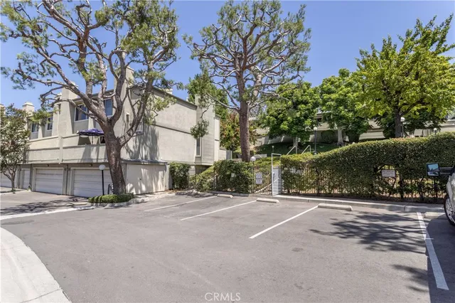 a front view of a house with a road