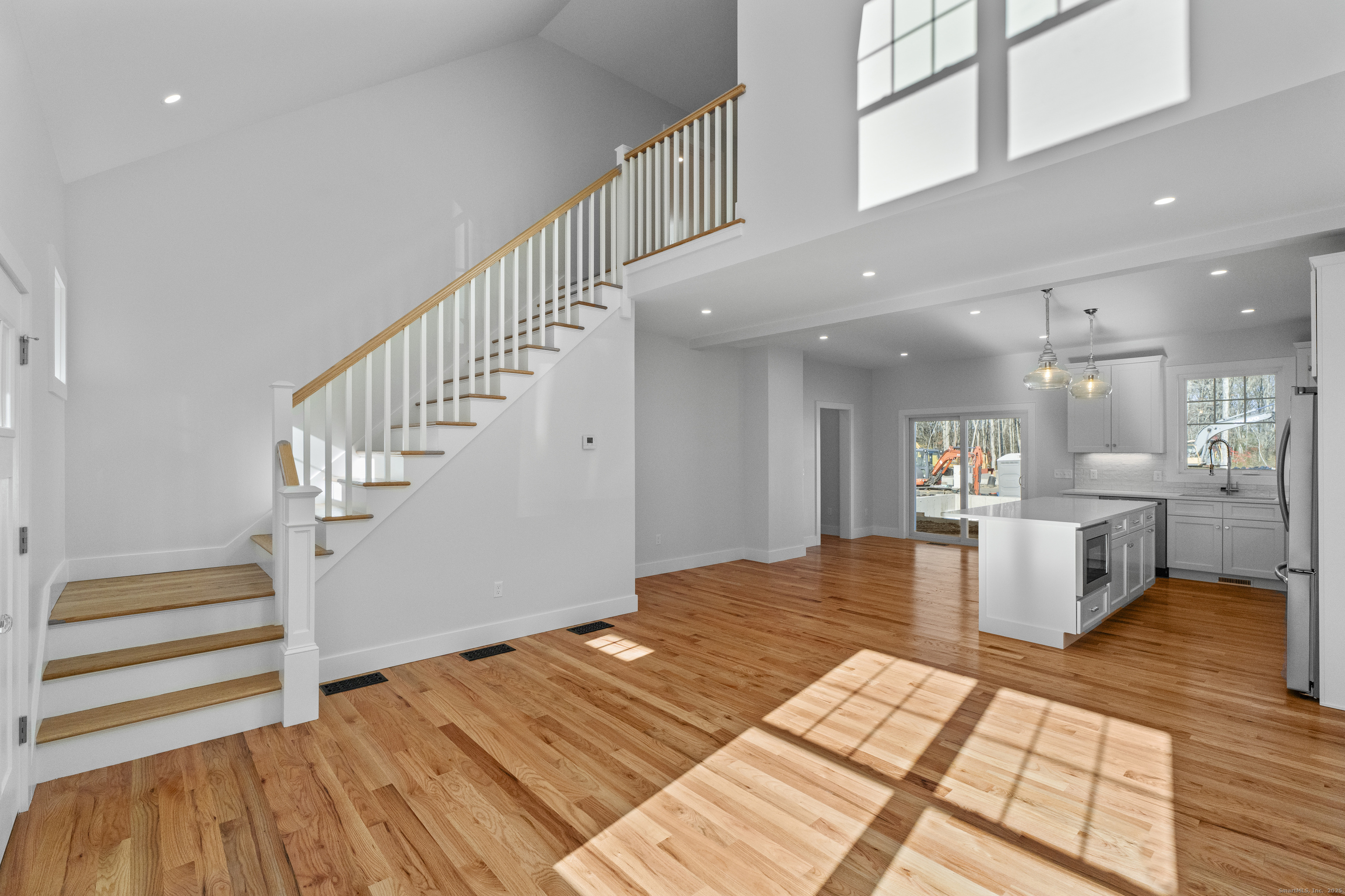 34 Ivy Hill Road, Unit 34 Waterford, CT 06385 - Photo 12 of 33 a view of a living room and kitchen view with wooden floor