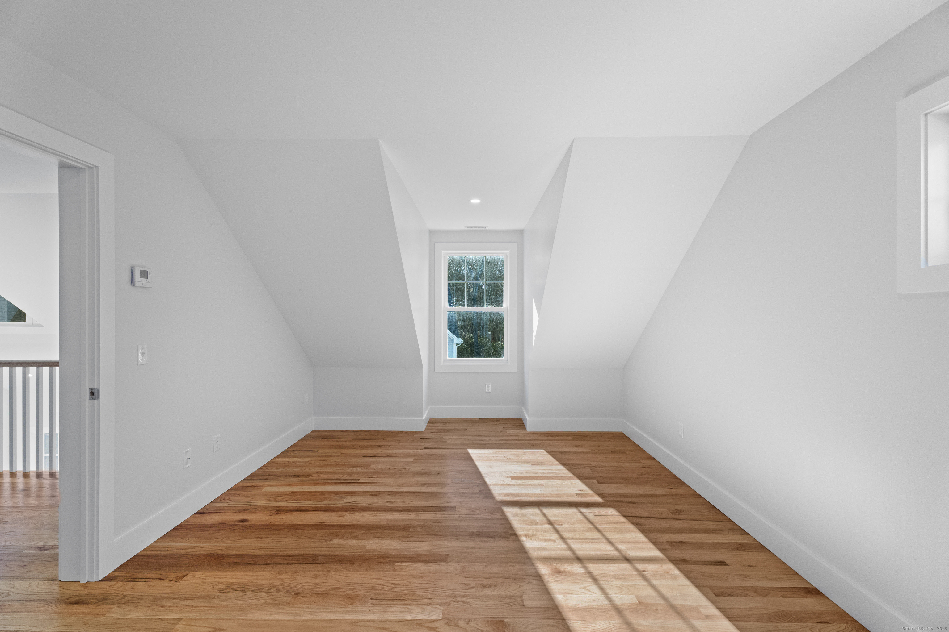 34 Ivy Hill Road, Unit 34 Waterford, CT 06385 - Photo 14 of 33 a view of a room with wooden floor and a window